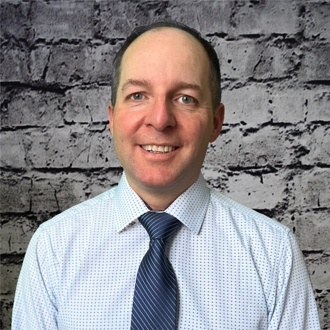 A headshot of Dave Doggett, media director, specializing in communication strategy and brand management for clients.