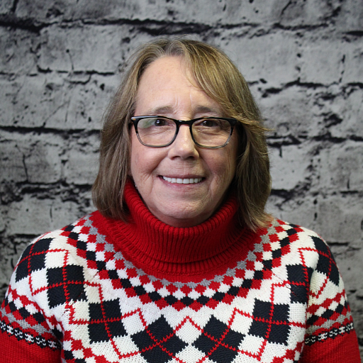 Professional image of Sami Small, an expert in trust sales, ready to assist clients with their financial planning.